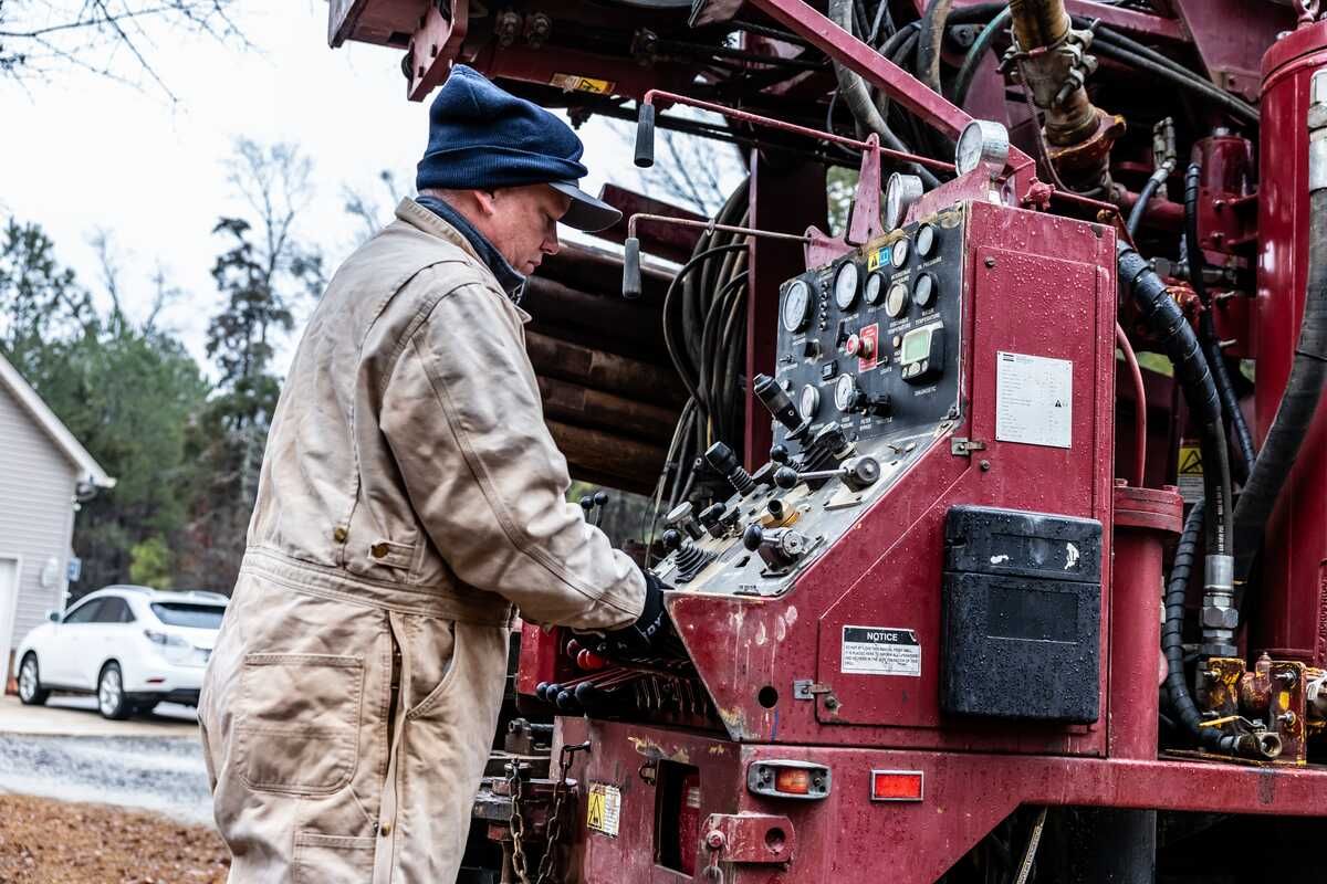 Austin Drilling technician working the rig controls on a well repair